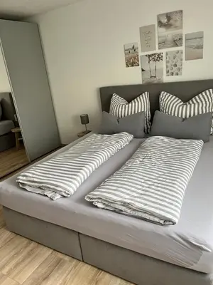 Ein Bett oder Betten in einem Zimmer der Unterkunft Ferienwohnung LINA