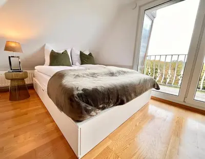 Ein Bett oder Betten in einem Zimmer der Unterkunft Reet am Rhein - Eröffnungsangebot