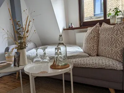 Ein Sitzbereich in der Unterkunft III Rhein Charme Studios Gemütlichkeit, Style & Geschichte bei Katrin und Familie III