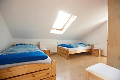 Ein Bett oder Betten in einem Zimmer der Unterkunft Ferienwohnung Weingut Ackermann