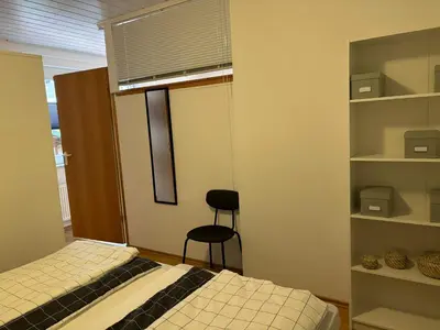 Ein Bett oder Betten in einem Zimmer der Unterkunft Ferienwohnung am Waldrand