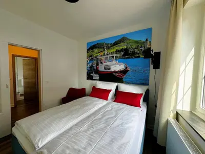 Ein Bett oder Betten in einem Zimmer der Unterkunft Ferienwohnungen Bullay
