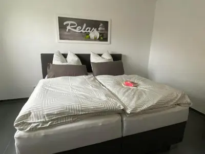 Ein Bett oder Betten in einem Zimmer der Unterkunft Ferienwohnung Flussufer No.12
