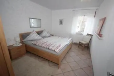 Ein Bett oder Betten in einem Zimmer der Unterkunft Ferienwohnung Konen