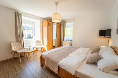 Ein Bett oder Betten in einem Zimmer der Unterkunft Gästehaus Mack - Mosel Rooms & Restaurant