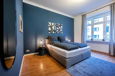 Ein Bett oder Betten in einem Zimmer der Unterkunft Südstadt-Oase 1 Komfort mit 2 SZ und Balkon