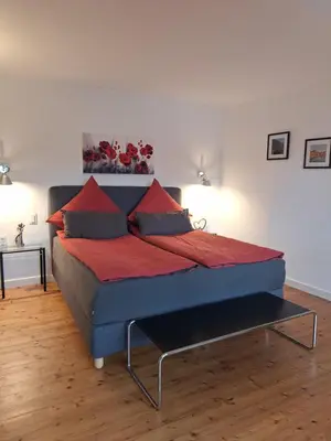 Ein Bett oder Betten in einem Zimmer der Unterkunft Moselperle- Urlaub im historischen Fachwerkhäuschen