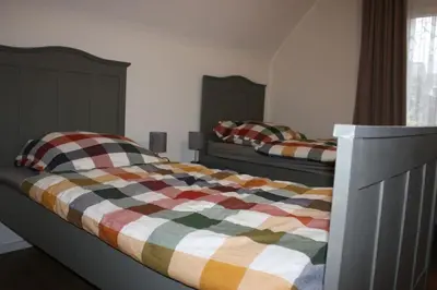 Ein Bett oder Betten in einem Zimmer der Unterkunft Eifelhäusje Schäfer