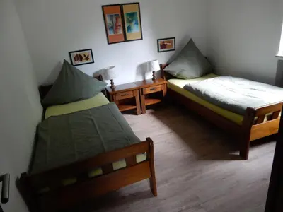Ein Bett oder Betten in einem Zimmer der Unterkunft Haus am Wald