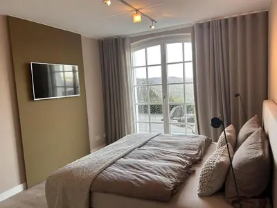 Ein Bett oder Betten in einem Zimmer der Unterkunft Ferienwohnung 