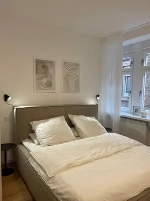 Ein Bett oder Betten in einem Zimmer der Unterkunft BG Living & Hosting - Stilvolle Mosel-Ferienwohnung 