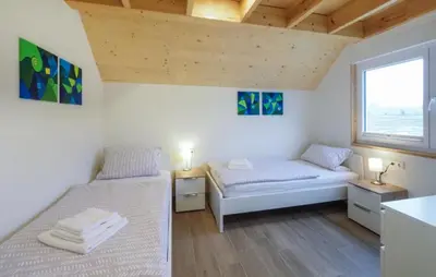 Ein Bett oder Betten in einem Zimmer der Unterkunft Ferienpark Wolfsschlucht