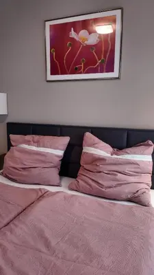 Ein Bett oder Betten in einem Zimmer der Unterkunft Wohnung mitten in der Altstadt