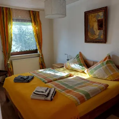 Ein Bett oder Betten in einem Zimmer der Unterkunft Haus am Römerstich
