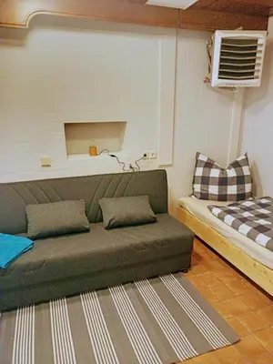 Ein Bett oder Betten in einem Zimmer der Unterkunft St Maximin Erdgeschoß Lounge