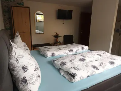Ein Bett oder Betten in einem Zimmer der Unterkunft Gästehaus A21