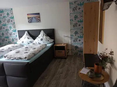 Ein Bett oder Betten in einem Zimmer der Unterkunft Gästehaus A21
