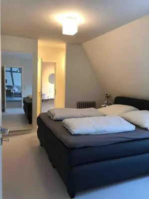 Ein Bett oder Betten in einem Zimmer der Unterkunft Wohnen direkt am Moselstrand