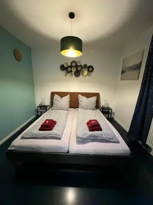 Ein Bett oder Betten in einem Zimmer der Unterkunft Relaxen im Weindorf Mayschoß Fewo 3