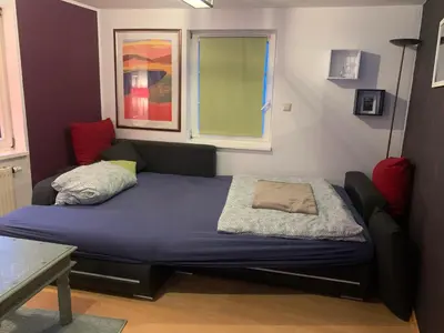 Ein Bett oder Betten in einem Zimmer der Unterkunft Am Zwingelbrunnen in der Altstadt