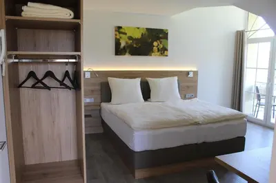 Ein Bett oder Betten in einem Zimmer der Unterkunft Ferienweingut Hansjosten