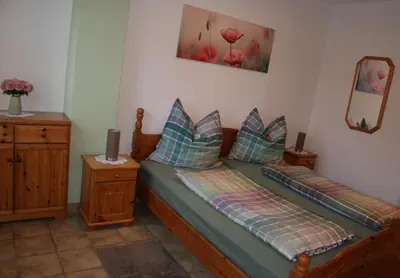 Ein Bett oder Betten in einem Zimmer der Unterkunft Moselblick - Ferienwohnung an der Uferpromenade
