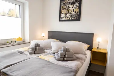 Ein Bett oder Betten in einem Zimmer der Unterkunft Ferienwohnung 