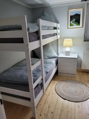 Ein Bett oder Betten in einem Zimmer der Unterkunft Quiddelbacher Mühle