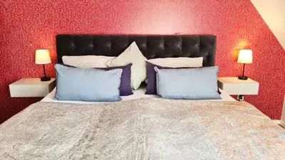 Ein Bett oder Betten in einem Zimmer der Unterkunft Weinstock - klimatisierte Ferienwohnung mit Sonnenterrasse