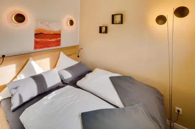Ein Bett oder Betten in einem Zimmer der Unterkunft Ferienhaus Eifeltraum Magma