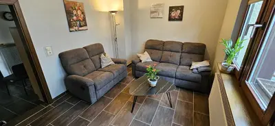 Ein Sitzbereich in der Unterkunft Ferienhaus In der Hohl
