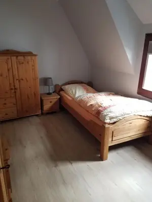 Ein Bett oder Betten in einem Zimmer der Unterkunft Ferienhaus In der Hohl