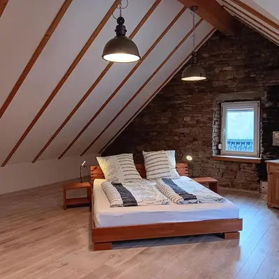 Ein Bett oder Betten in einem Zimmer der Unterkunft Eifler Brunnenhaus