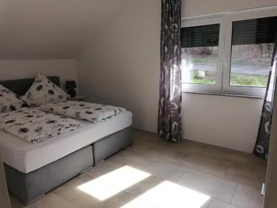 Ein Bett oder Betten in einem Zimmer der Unterkunft Haus Kleeblatt