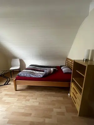 Ein Bett oder Betten in einem Zimmer der Unterkunft Ferienwohnung Schneider
