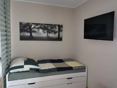 Ein Bett oder Betten in einem Zimmer der Unterkunft Ferienwohnung Hedi