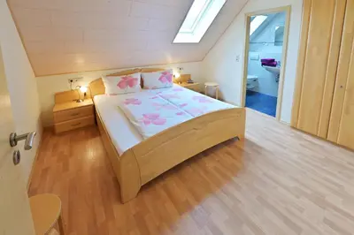 Ein Bett oder Betten in einem Zimmer der Unterkunft Ferienweingut Ulrich Göbel