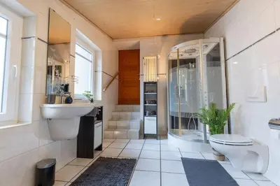 Ein Badezimmer in der Unterkunft Lava-Lodge (Ferienhaus)