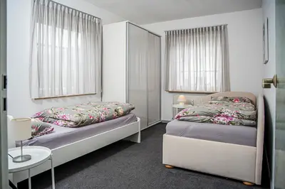Ein Bett oder Betten in einem Zimmer der Unterkunft Haus Helga