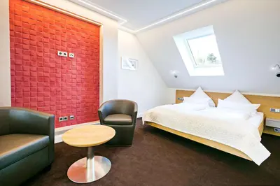 Ein Bett oder Betten in einem Zimmer der Unterkunft Schloss Hotel Burgbrohl