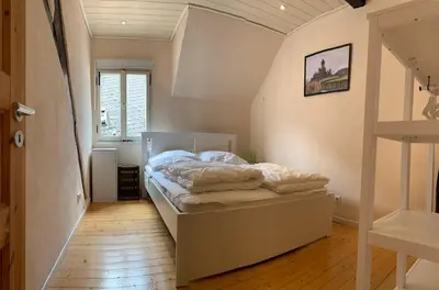 Ein Bett oder Betten in einem Zimmer der Unterkunft Ferienhaus Am Balduinstor