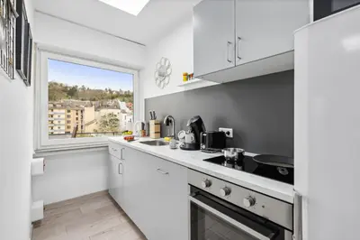 Küche/Küchenzeile in der Unterkunft Moderne, Zentrale und Gemütliche Unterkunft