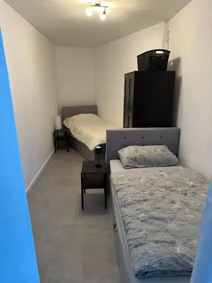 Ein Bett oder Betten in einem Zimmer der Unterkunft Mani´s Feriendomizil Neuwied