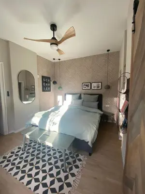 Ein Bett oder Betten in einem Zimmer der Unterkunft Cues11