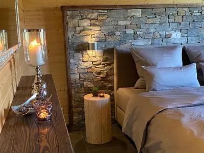 Ein Bett oder Betten in einem Zimmer der Unterkunft Holzhaus Onkel Fritz mit Sauna und Whirlwanne