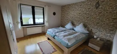 Ein Bett oder Betten in einem Zimmer der Unterkunft Haus Maria