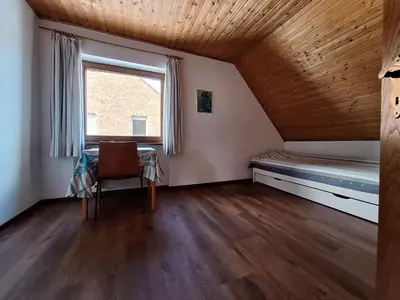 Ein Bett oder Betten in einem Zimmer der Unterkunft Ferienwohnungen Burgstraße 8