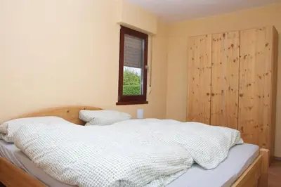 Ein Bett oder Betten in einem Zimmer der Unterkunft Ferienhaus Vollmersbach