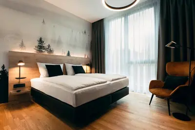 Ein Bett oder Betten in einem Zimmer der Unterkunft TARGET WORLD Hunter's Lodge