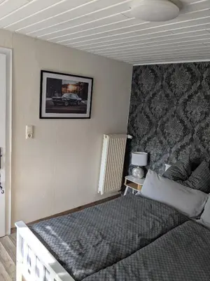 Ein Bett oder Betten in einem Zimmer der Unterkunft Eva's Home